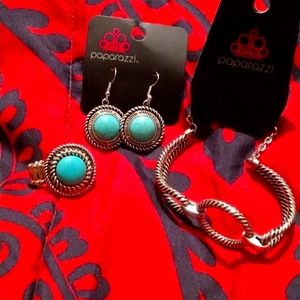 A three piece set bracelet earrings and ring